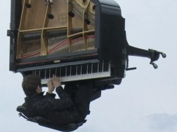 The pianist performed the composition on a grand piano hanging on a crane