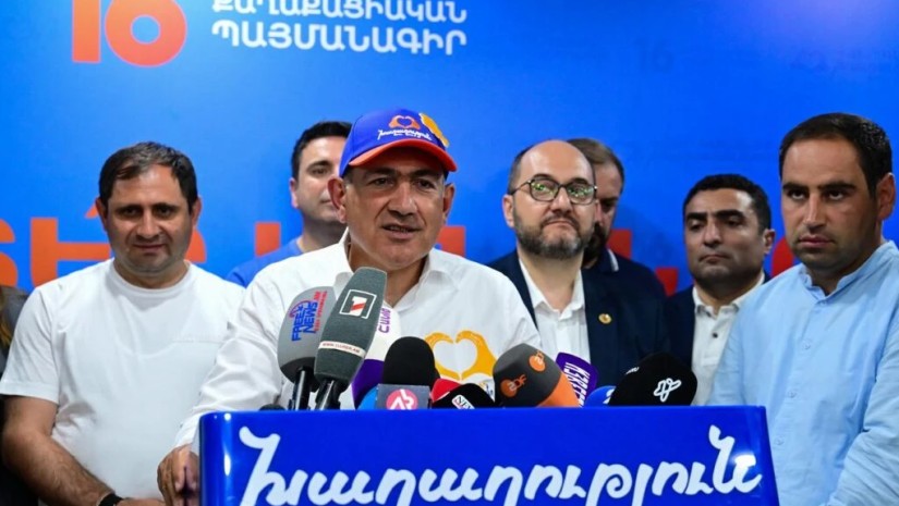 მი